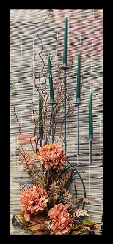 An amazing faux flower design created on an vintage metal candle stick, floor standing approx 4 ft tall